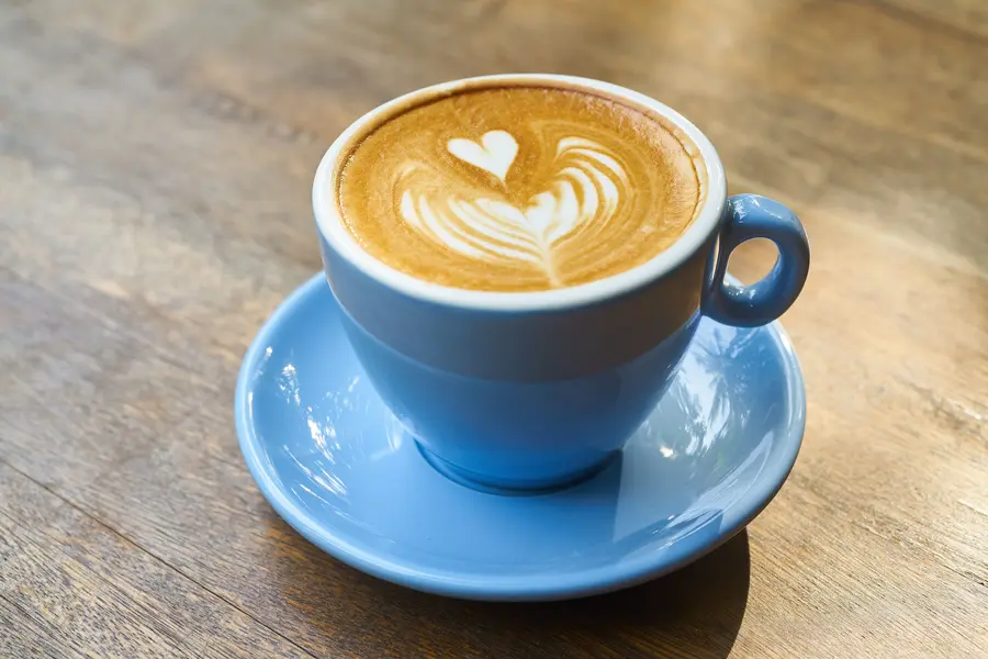 A cup of coffee on a wooden table