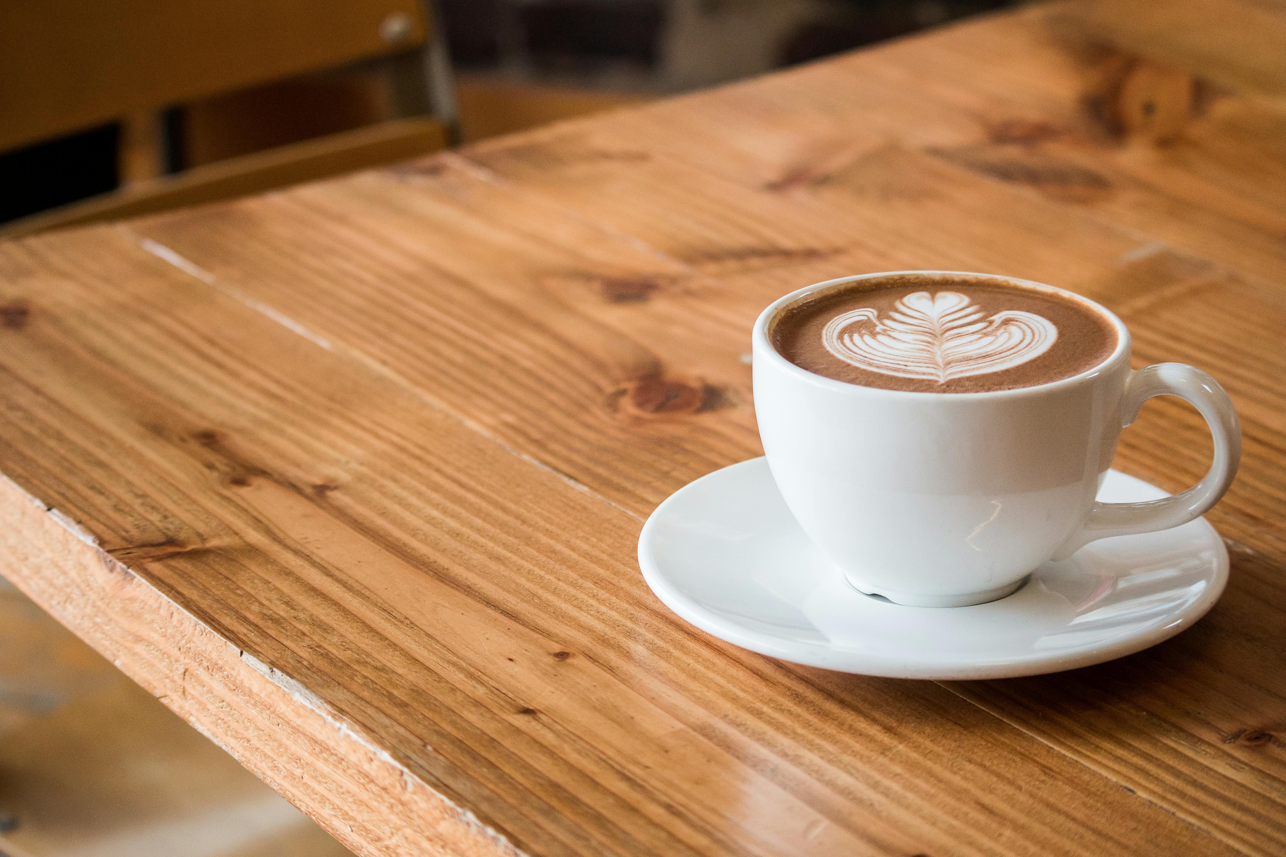 A cup of coffee on a wooden table